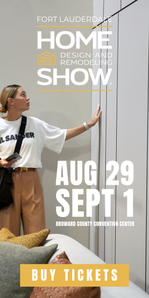 Woman pointing at cabinetry in a modern design display – Home Design and Remodeling Show August 29 to September 1.