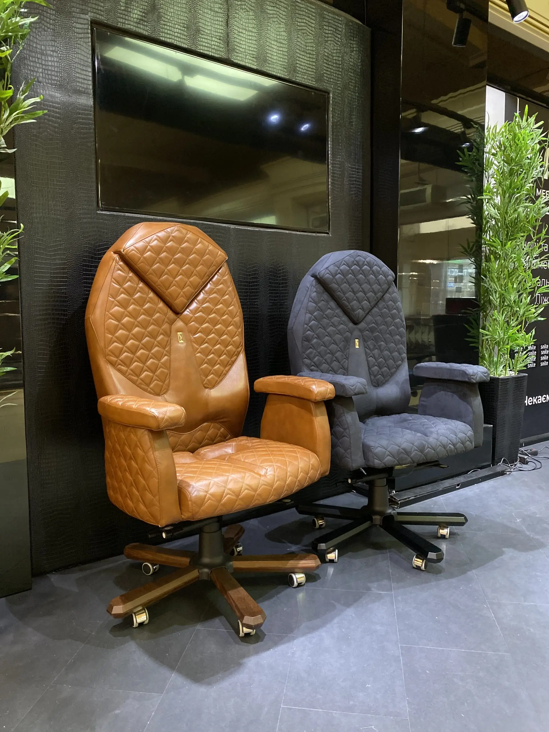 Luxury leather recliners showcased at the Home Design and Remodeling Show furniture exhibit.