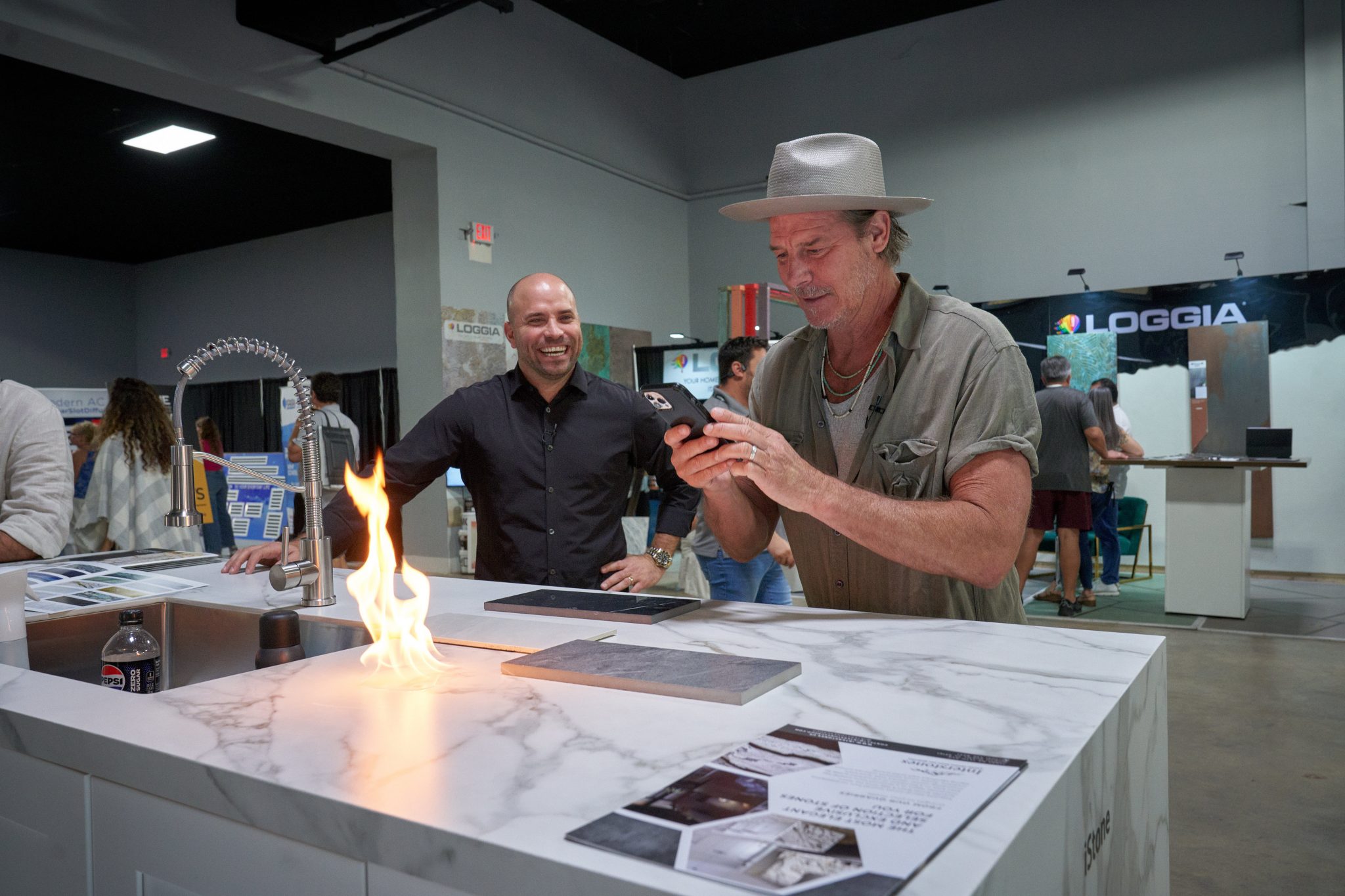 Two chefs demonstrating a dish together during a cooking session at the Home Design and Remodeling Show.
