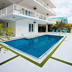 Luxury home with pool and patio featured in the Home Design and Remodeling Show real estate showcase.