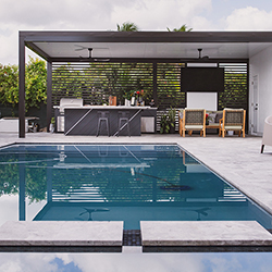 Poolside entertainment area with outdoor kitchen and covered lounge space featured at the Home Design and Remodeling Show.